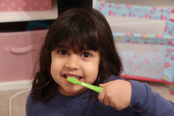 Girl Brushing Teeth